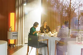 Guests seated at a table at the Steirereck restaurant