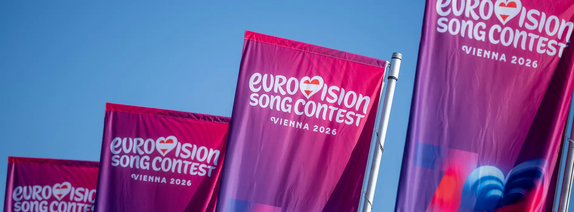 Flags featuring the Eurovision Song Contest 2026 logo in Vienna