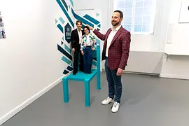 Beuchet Chair with visitors at the Museum of Illusions