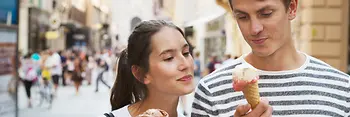 Strolling around in the Old City, couple eating ice cream