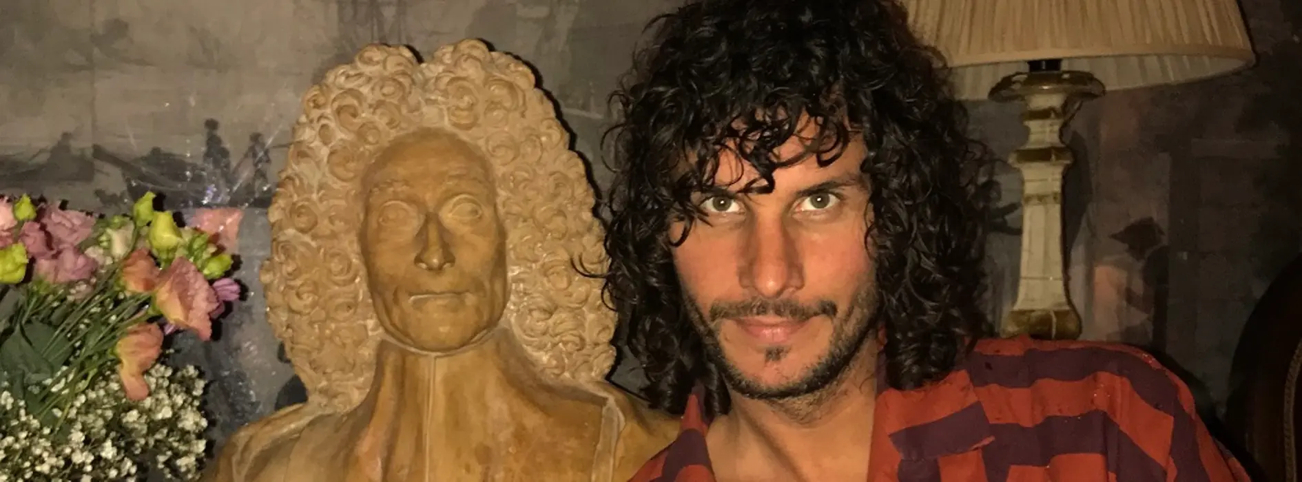 DJ and producer Wolfram with a bust of Mozart