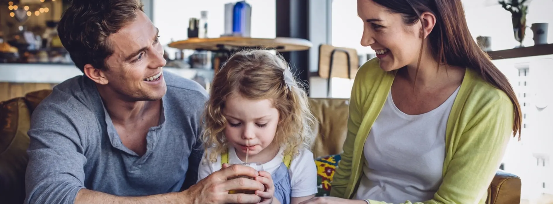 Couple with a child in a restaurant