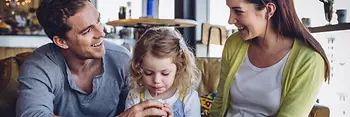 Couple with a child in a restaurant