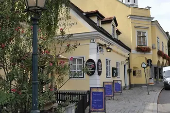 People going for a walk in the wine town of Grinzing