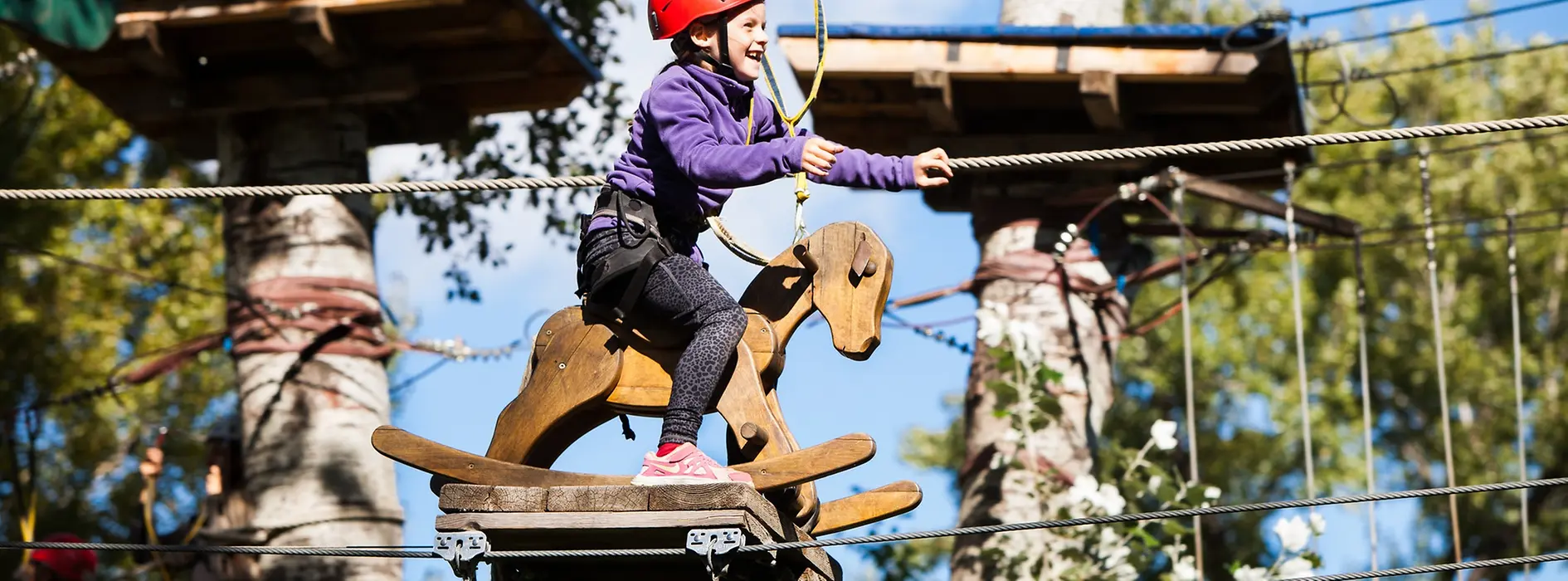 Girl in the high-rope climbing garden in the Gänsehäufelbad