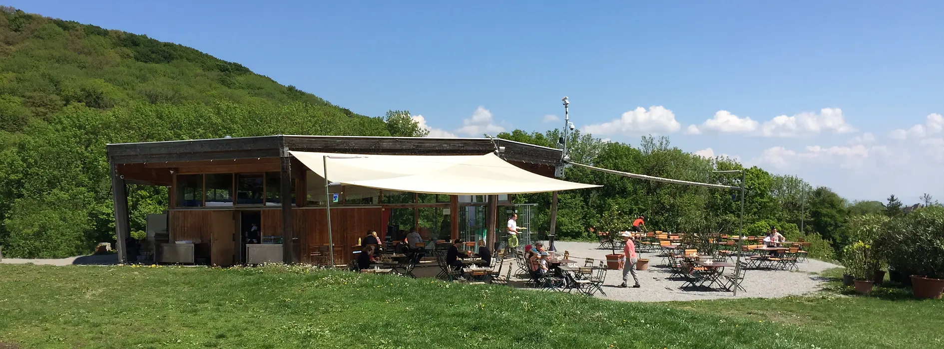 Restaurant on a hill with a terrace in front of it