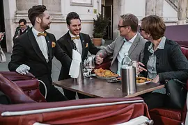 Couple dining in a horse-drawn carriage