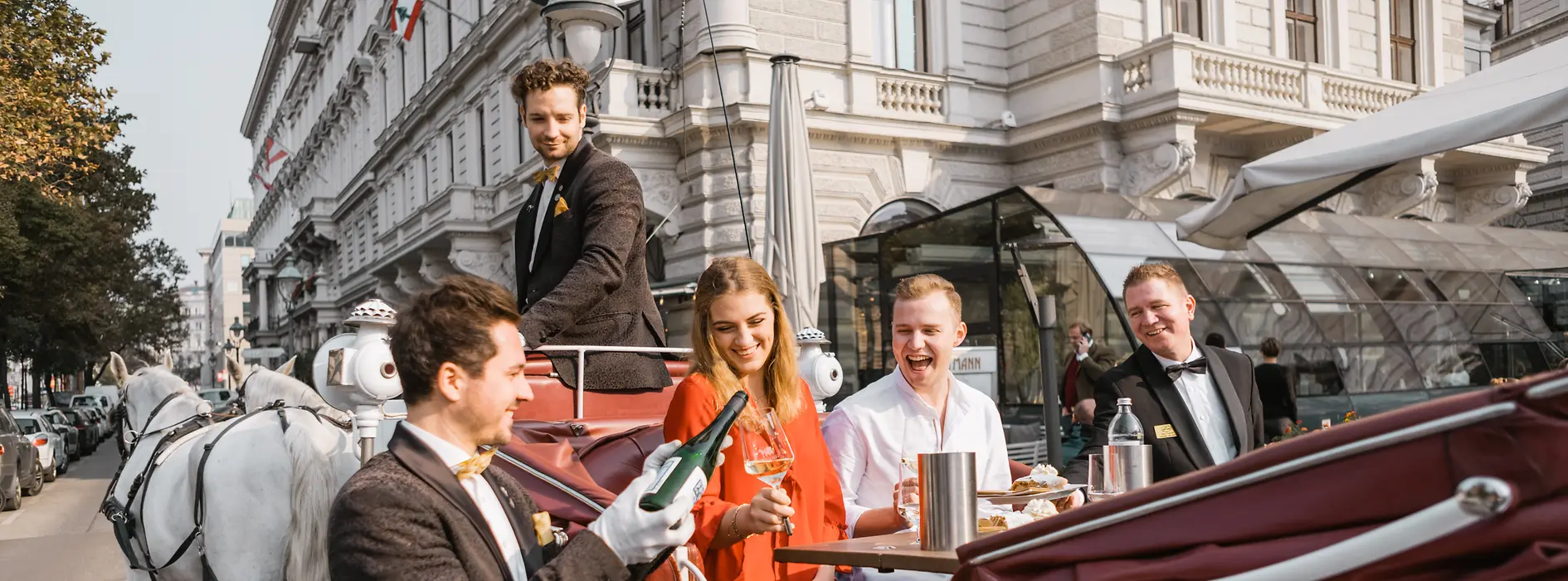 People riding in a horse-drawn carriage in Vienna