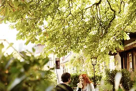 Couple having drinks at Heuriger Schübel-Auer