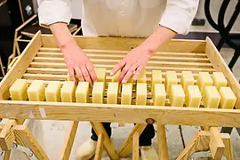 Cut bars of soap before they are packed 
