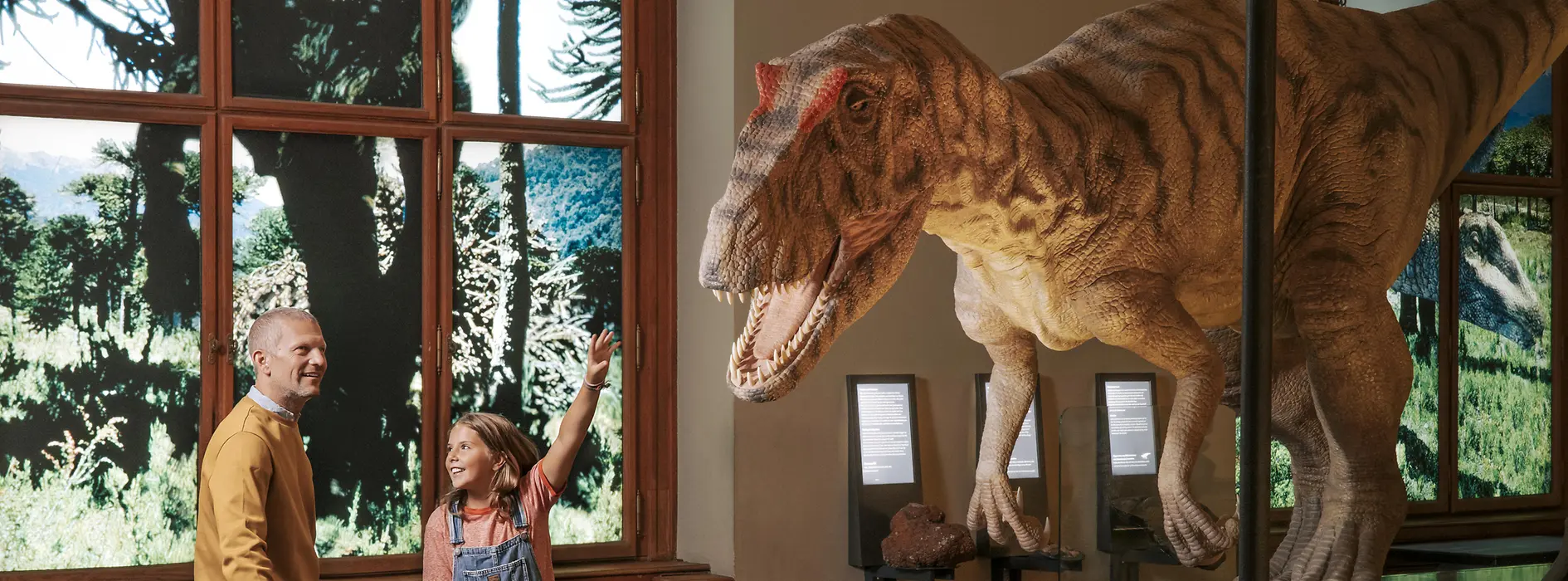Family in the Naturhistorisches Museum Vienna marvels at dinosaurs