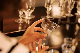 Woman holding a crystal glass