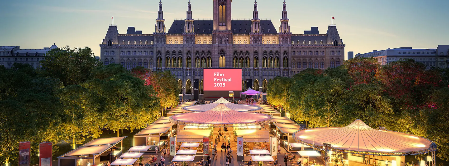 Evening aerial view of the 2025 Film Festival in front of Vienna City Hall with numerous stalls.